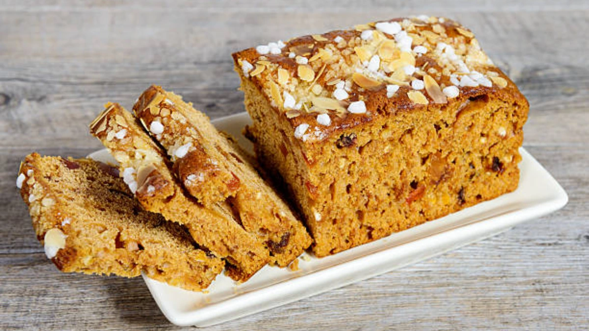 A delicious gluten-free Milk Bar pumpkin pie with a golden crust and creamy pumpkin filling, topped with a dusting of spices.