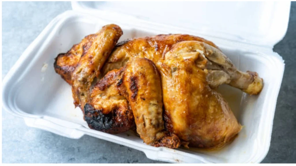 Rotisserie chicken stored in an airtight container with proper labeling for maximum freshness in the refrigerator