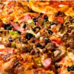 "A freshly baked American-style pizza pie with a golden crust, melted cheese, pepperoni, and vibrant toppings like green bell peppers and mushrooms."